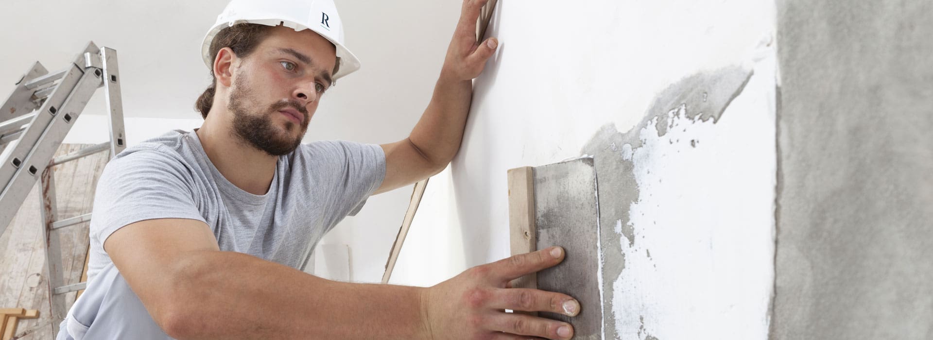 Builder plastering wall