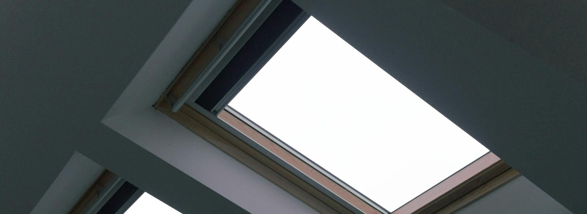Skylight with cloudy sky view.